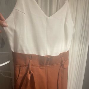 Long white and dark orange romper. Obsessed with this romper but doesn’t fit.